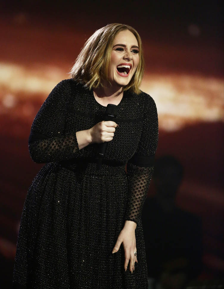 Adele performs on The X Factor finale with a new bob 