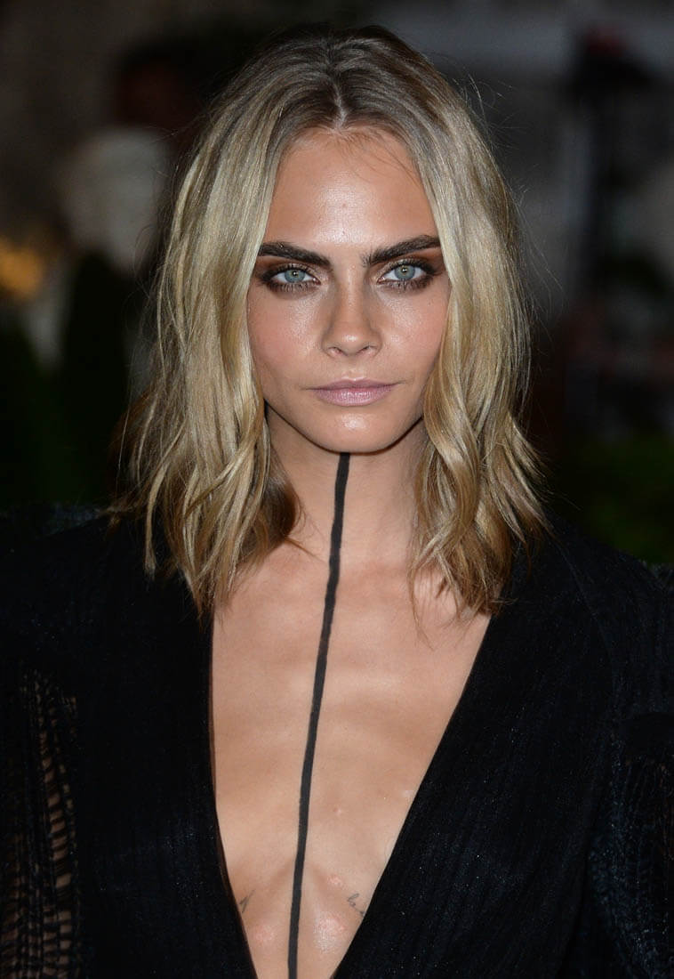 Cara Delevingne at Burberry show during London Fashion Week with black