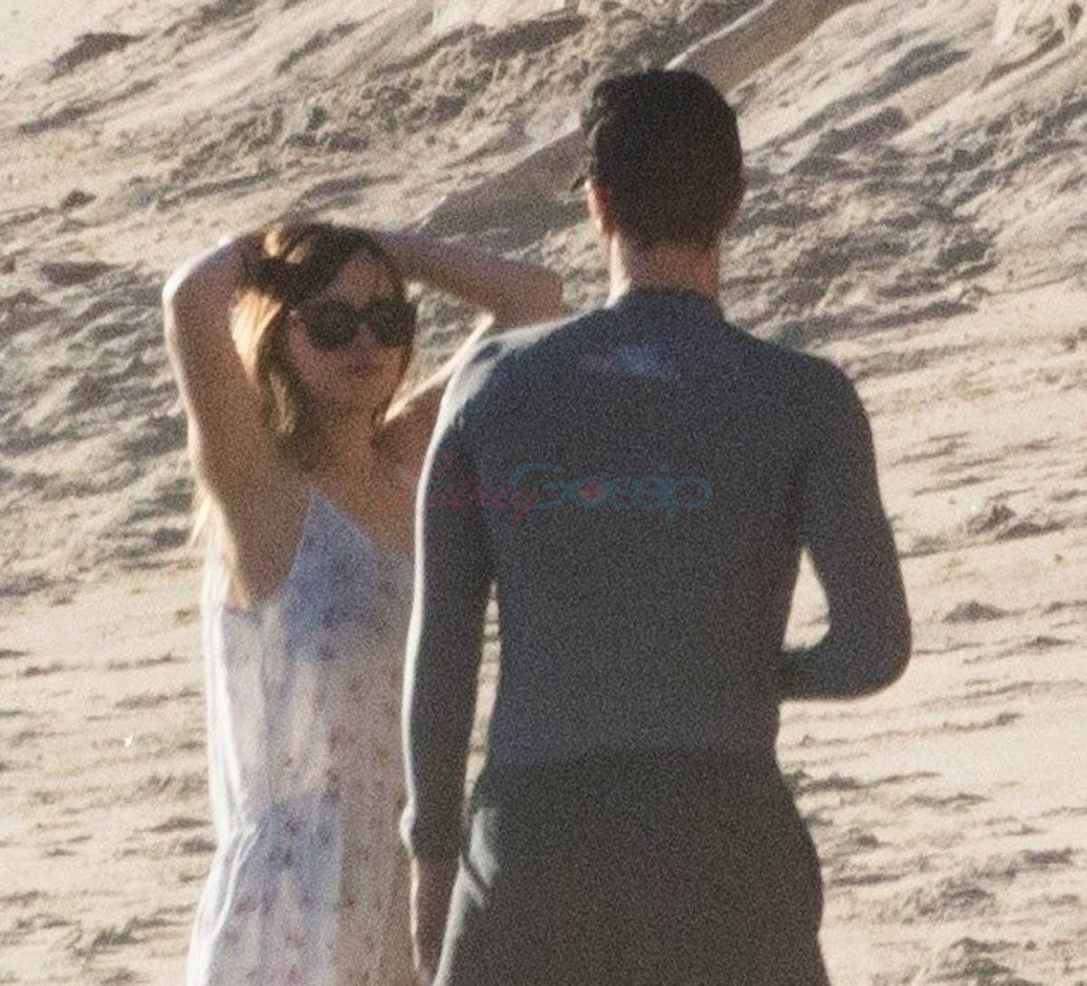 Dakota Johnson and Chris Martin on the beach together in Malibu1200 x 1088