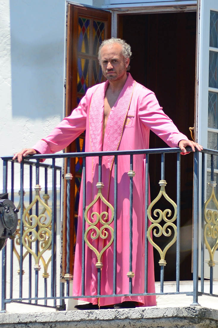 Gianni Versace in a pink robe 