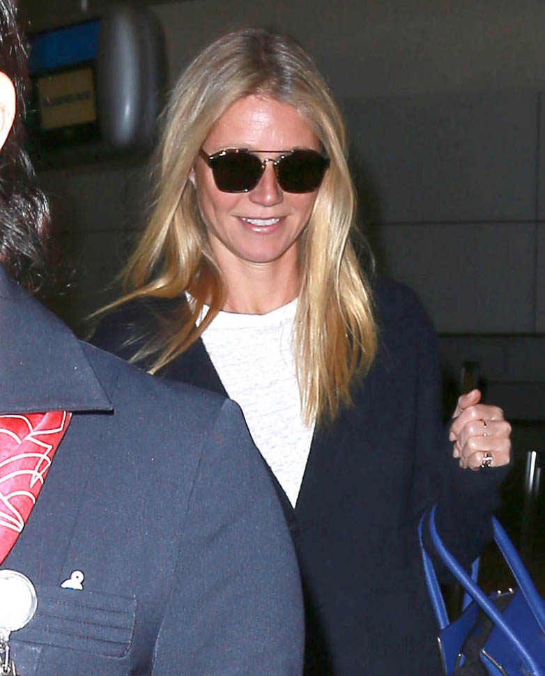 Gwyneth Paltrow and Brad Falchuk pose with Valentino and arrive at LAX ...