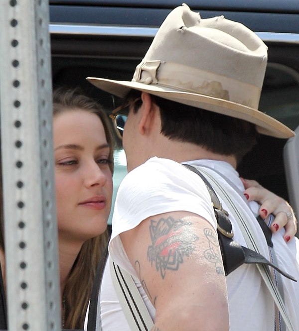 Johnny Depp kisses Amber Heard before flying out of NYC 