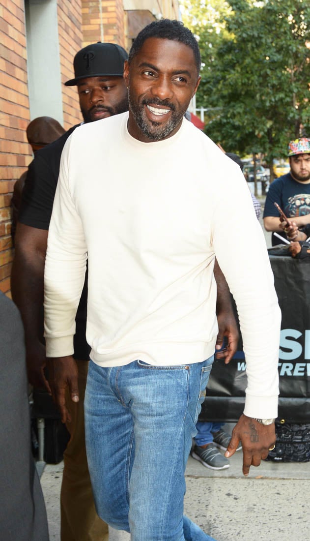 Idris Elba looks great in a white sweater at The Daily Show in New York