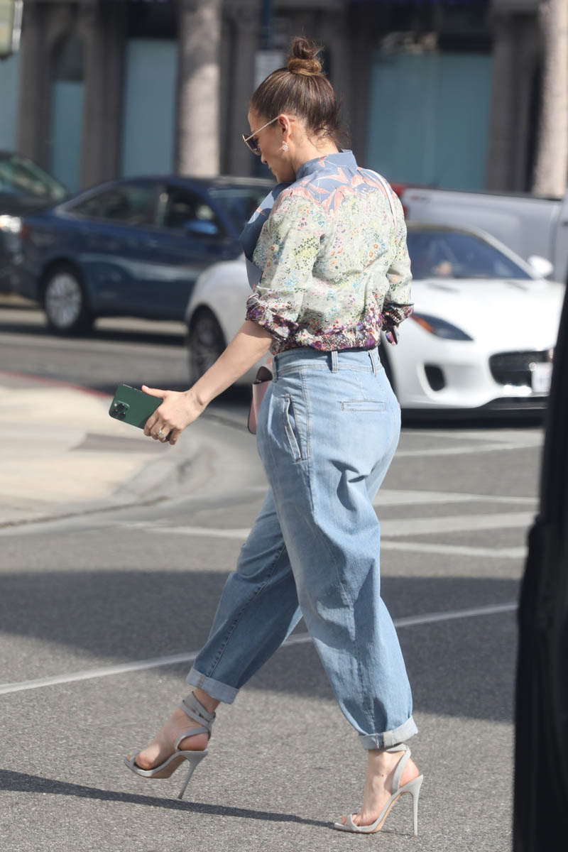 Jennifer Lopez shops on Rodeo drive in a great pair of pleated jeans as she  prepares to begin promotion for Netflix's Halftime