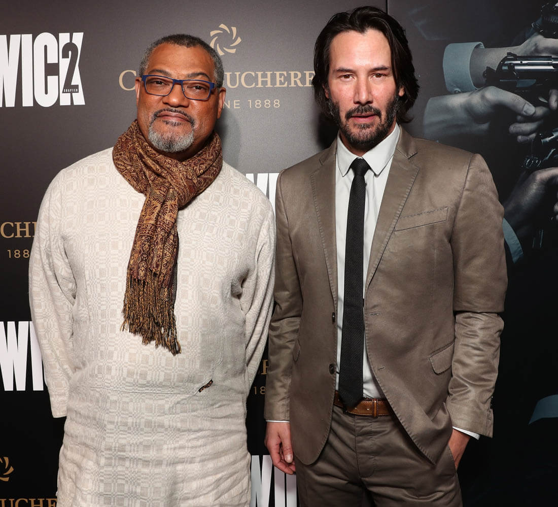 Laurence Fishburne, left, and Keanu Reeves, cast members in John Wick:  Chapter 2, pose together at the premiere of the film at ArcLight Cinemas  on Monday, Jan. 30, 2017, in Los Angeles. (