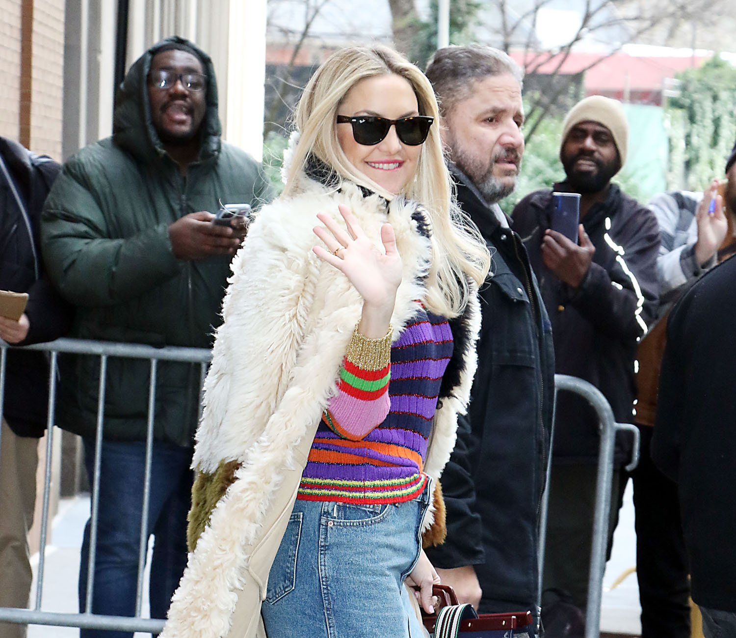 Kate Hudson dons a black sweater and leggings while visiting a