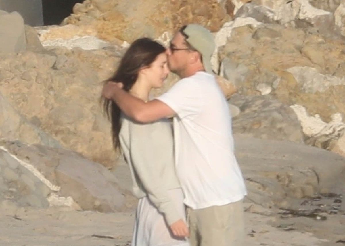 Leonardo DiCaprio and Camila Morrone share a tender moment on the beach ...