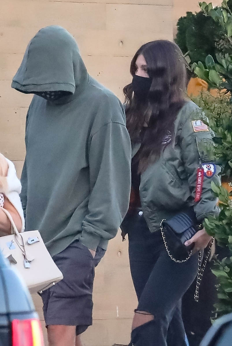 Leonardo DiCaprio is happy to hide his face behind a mask while for dinner with Camila Morrone