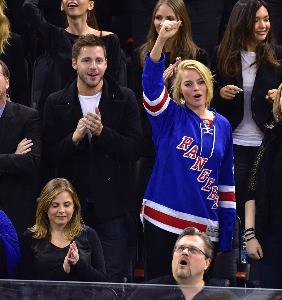 Margot Robbie and Tom Ackerley watch the Arizona Coyotes play the New York  Rangers at Madison