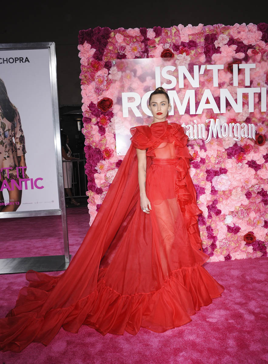 Miley Cyrus stands in for Liam Hemsworth at Isn't It Romantic premiere