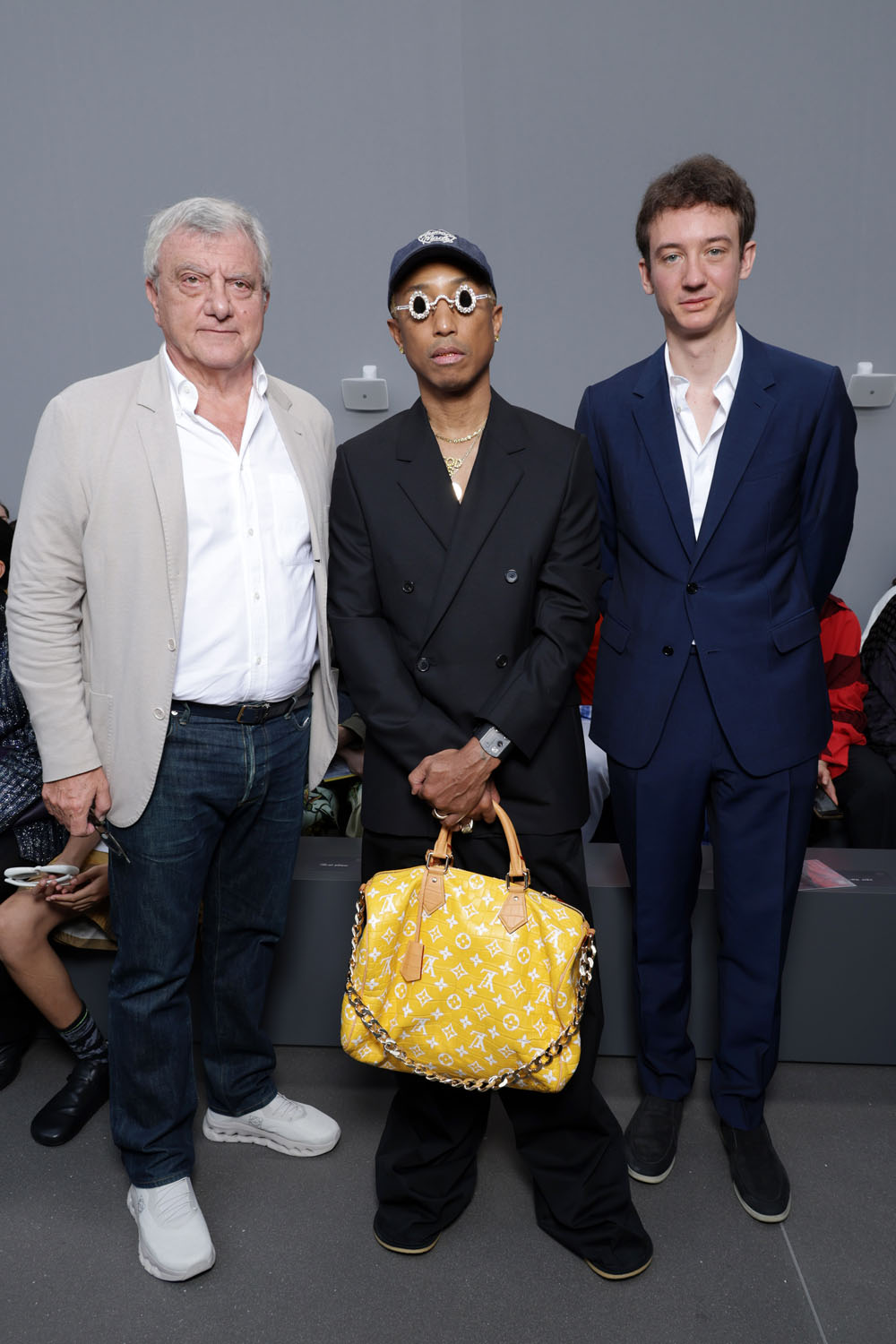 Pharrell Williams takes a victory lap at the Loewe show in Paris,  accessorising with his Millionaire bag