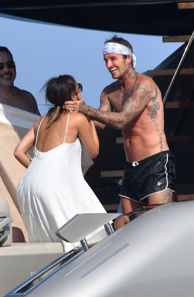 David and Victoria Beckham kiss on Elton John's boat while on vacation ...