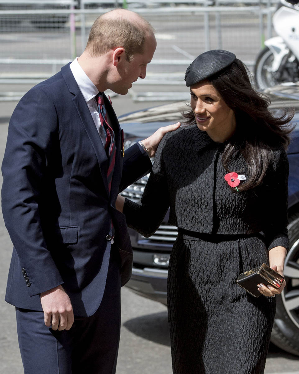 Prince William greets Meghan Markle with a kiss on both cheeks at an ...