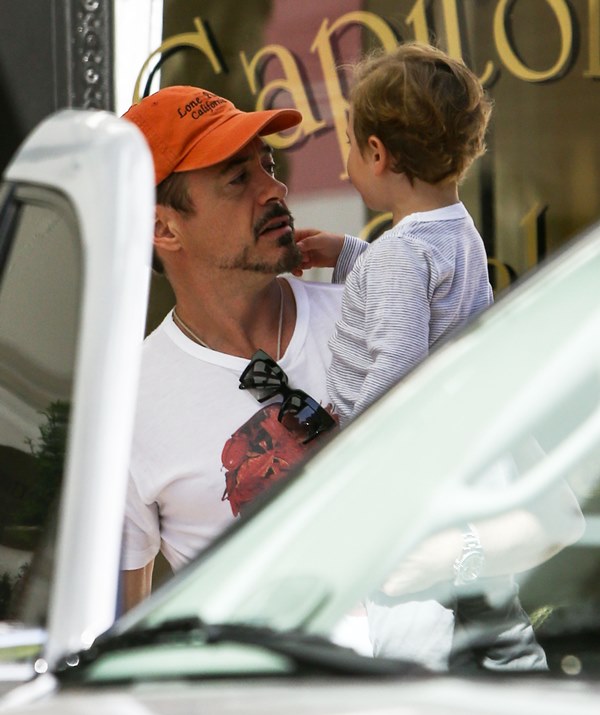 Robert Downey Jr and Jeremy Renner with their kids in 
