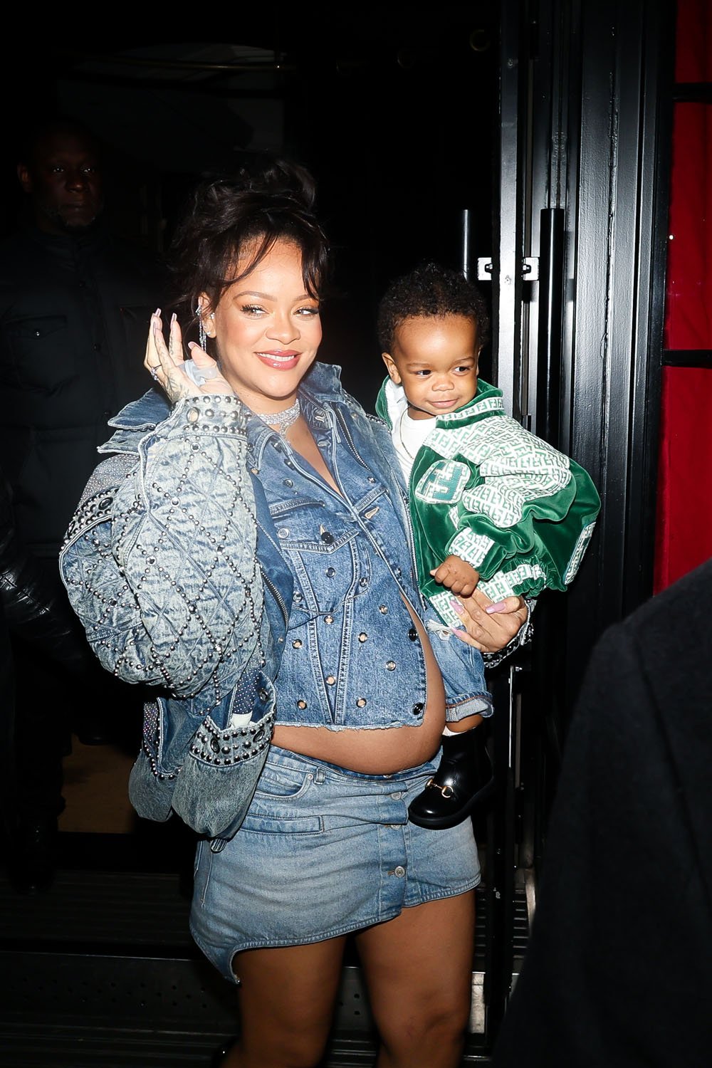 Rihanna in Paris with her adorable, stylish baby dressed in a velvet