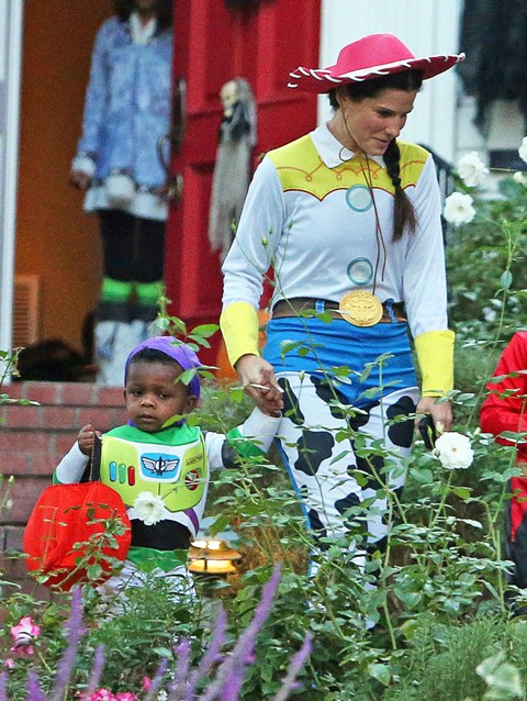 Sandra Bullock dresses up as cowgirl Jessie with son Louis for Halloween