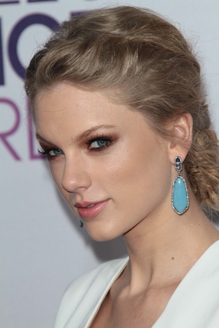 Taylor Swift’s white low cut revenge dress reveals possible breast ...